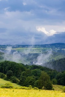 Scharfenstein Castle seen through the rain and fog