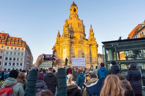 In Dresden, about 3, 000 people gathered on Neumarkt in front of the Church of Our Lady. On posters