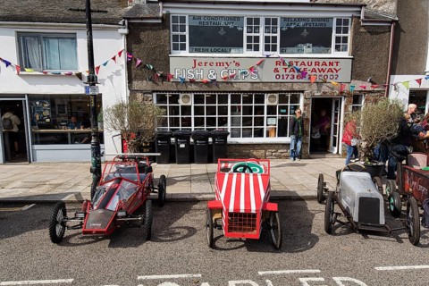Traditional soapboxes parked by the roadside in the town centre, Lafrowda Festival 2023, St Just in