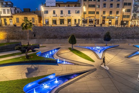 Modern architecture and colourfully lit fountains of Eleftheria Square at dusk, Nicosia, Cyprus,