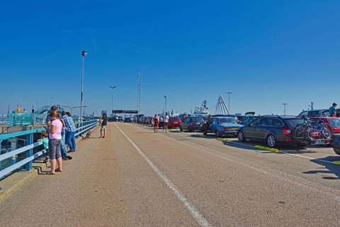 Den Helder, Holland, North Netherlands, August 2019: Cars and people waiting to board ferry to