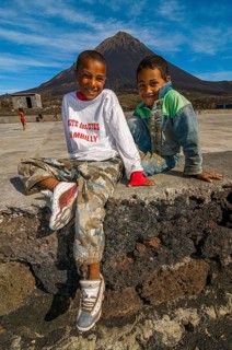 Smiling, happy boys in front of vulcano on Fogo. Cabo Verde. Africa