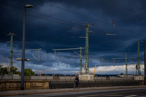 Marienbrücke with stormy sky and cyclists