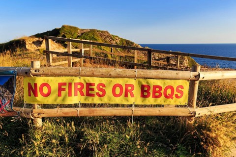 Sign on the railings, No fires or barbecues, Nature conservation, Dorset, England, Great Britain