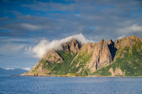 Mountains by the sea, fjord, fishing village Hovden, island Langoya, archipelago Vesteralen,