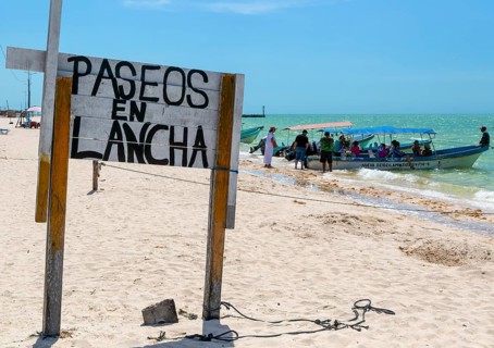 Sign at launch point on beach for tourist boat trips, Paseos en Launch, Celestun, Yucatan, Mexico,