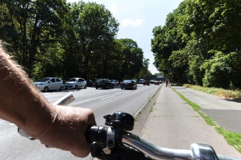 Cycling from a first-person perspective on a cycle path in Cologne, North Rhine-Westphalia,