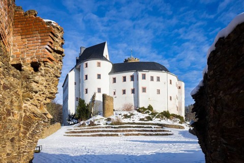 Scharfenstein Castle is a Spornburg on an elongated spur above the village of Scharfenstein