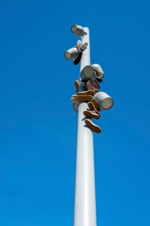 Trainers hanging from a modern light pole, Berlin, Germany, Europe