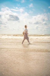 Woman on the beach in the evening sun, Zandvoort, Netherlands