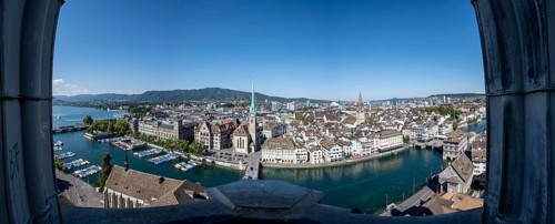 Panorama, view over the old town of Zurich with river Limmat, church Fraumünster and Münsterbrücke,
