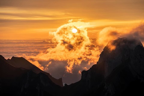 Sunrise, sun shining over mountains in fog, Säntis, Appenzell Ausserrhoden, Appenzell Alps,