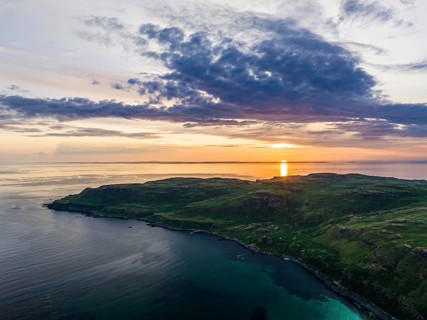 Sunset over Calgary Beach and Bay from a drone, Isle of Mull, Scottish Inner Hebrides, Scotland, UK