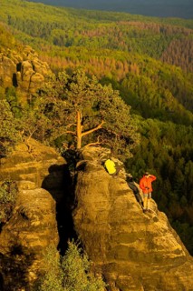 Schrammstein view in the Elbe Sandstone Mountains Looking up the Elbe. Leisurely hikers clamber