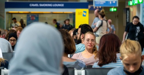 Waiting hall, Young woman waiting for her departure, Check-in, Munich Airport, Bavaria, Germany,
