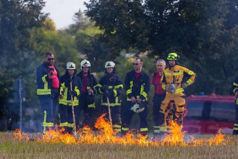During controlled field fires, the firefighters were able to test various extinguishing methods,