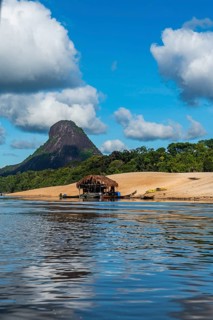 Illegal gold hut on the Mavecure river, before the granite hills, Cerros de Mavecure, Eastern