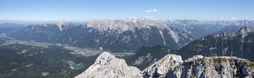 Aerial view, Alpine panorama, hikers at the summit cross, Westliche Wettersteinspitze, Wetterstein
