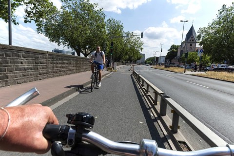 Cycling from a first-person perspective on a cycle path in Cologne, North Rhine-Westphalia,