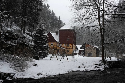 Historic Buschmühle Inn in the Kirnitzsch Valley in winter, Saxon Switzerland, Elbe Sandstone