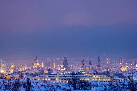 View from the Dresdner Heller to the wintery snow-covered Dresden Old Town with its towers