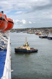 Tug, towing assistance, EDDY Tug towing the ferry King Seaways out of the harbour of Ijmuiden,