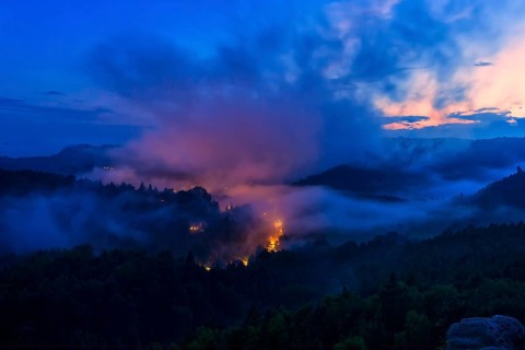 DEU Saxony Rathen Gamrig near Rathen under a full moon in the evening mist The Basteige area with