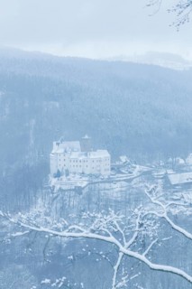 Scharfenstein Castle is a Spornburg on an elongated spur above the village of Scharfenstein