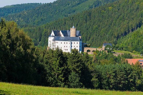 Scharfenstein Castle Scharfenstein Castle is located on an elongated mountain spur above the