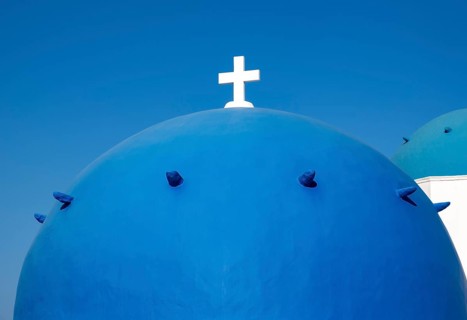 Close-up of blue dome with white cross, Agios Spiridonas, St Spyridon Church, Ia, Oia, Santorini,