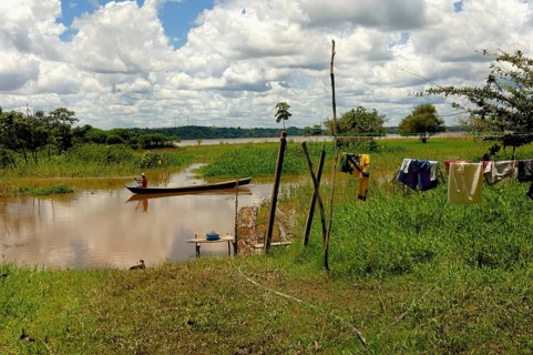 Man of caboclos tribe paddling in his canoe (Amazona) river, Amazon state, Brazil, South America