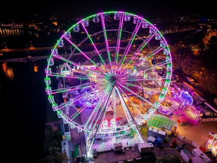 A 55m high illuminated Ferris wheel is the landmark of the fair at the Volksfest grounds on