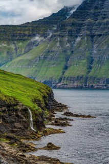 Waterfall into the ocean, Bordoy, Faroe islands, Denmark, Europe