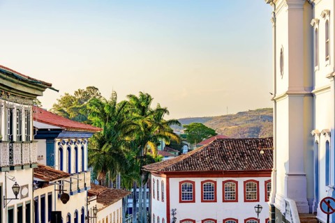 Historic center of the city of Diamantina with its colonial-style houses, hill and palm trees,