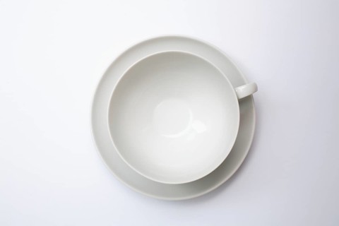 Tableware, empty teacup with saucer, seen from above