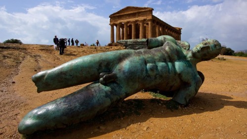 Super wide angle shot, bronze statue of fallen Icarus, Concordia Temple, Valley of the Temples,