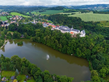 Wildenfels Castle rises on a mountain spur above the town of Wildenfels near Zwickau in Saxony. It