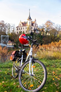 Symbolic image Resting on an e-bike tour in the Leipzig region in Grimma at the Mulde bridge
