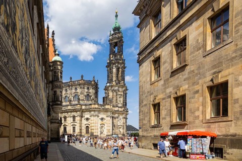 Tourists stroll across the Schlossplatz to the Princes' Procession