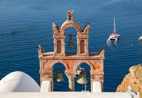 Old belfry wiith yacht and blue sea, Ia, Oia, Santorini, Greece, Europe
