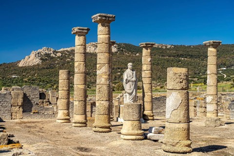 Trajan statue and basilica of the Roman ruins of Baelo Claudia in Bolonia, Tarifa, Costa de la Luz,