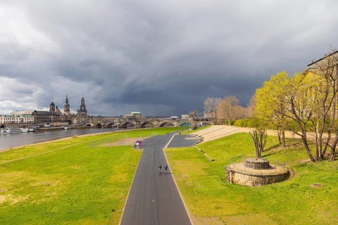 A rain shower passes over Dresden's Old Town on the Elbe River