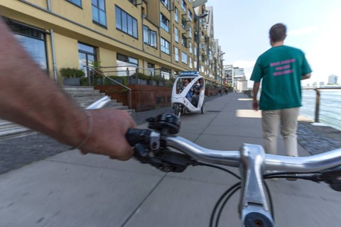 Cycling from the first-person perspective on a shared footpath and cycle path in Cologne, North