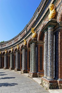Arcade, columns, gilded bust, facade, exterior walls, ornate, colorful, coloured, coloured stones,
