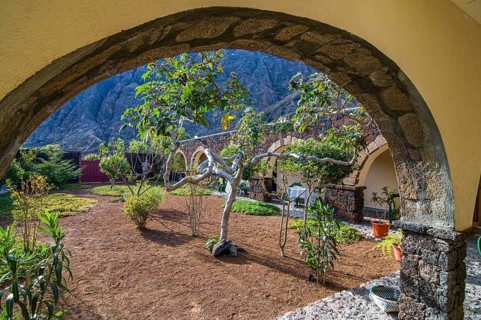 Inner yard of stone house, view through arch. Fogo. Cabo Verde. Africa