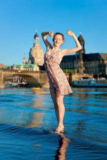 Young woman on the Elbe meadows in Dresden