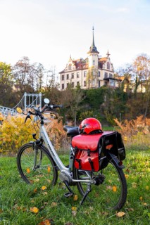Symbolic image Resting on an e-bike tour in the Leipzig region in Grimma at the Mulde bridge