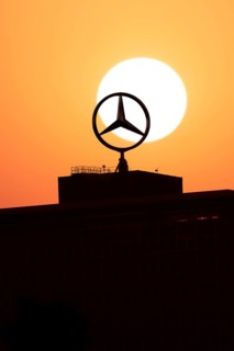 Mercedes star on Mercedes Benz branch in Stuttgart, sunset, Baden-Württemberg, Germany, Europe