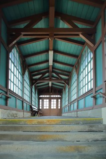 Access through corridor and cabin, vestibule, window, wooden beams at the station of the