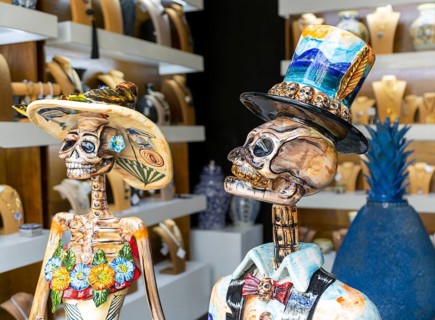 Ceramic skull and bones death artwork pieces inside gallery shop, Calzado Calle de los Frailes,